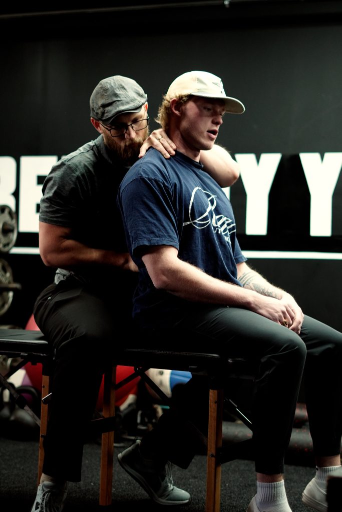 Dr. Jacob Stoffel adjusts a patient's back